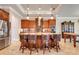 Beautiful kitchen featuring wood cabinets, granite countertops, a tile backsplash, and a large center island at 3979 Mammoth Grove Rd, Lake Wales, FL 33898
