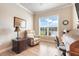Bright office space featuring a comfortable recliner and large window with backyard views at 3979 Mammoth Grove Rd, Lake Wales, FL 33898