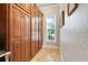 Pantry featuring ample cabinet space and a bright window for natural light at 3979 Mammoth Grove Rd, Lake Wales, FL 33898