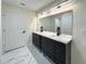 Stylish bathroom showcasing a double vanity with modern fixtures at 481 S East Ave, Bartow, FL 33830