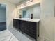Stylish bathroom showcasing a double vanity with modern fixtures at 481 S East Ave, Bartow, FL 33830