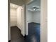 Bright bedroom with hardwood floors, ceiling fan, and a walk-in closet at 481 S East Ave, Bartow, FL 33830