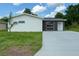 Charming home with a contemporary two-tone exterior and a well-manicured front yard at 481 S East Ave, Bartow, FL 33830