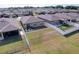 Aerial view of homes with spacious backyards, patios, and privacy fencing in a suburban neighborhood at 8830 Fox Dr, Polk City, FL 33868