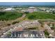 An aerial view showcasing the community's layout, lush green spaces, and convenient access to nearby highways at 8830 Fox Dr, Polk City, FL 33868