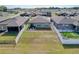 Large backyard with a white privacy fence, offering ample space for entertaining and outdoor activities at 8830 Fox Dr, Polk City, FL 33868