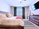 Neutral bedroom with TV and ensuite bathroom at 8830 Fox Dr, Polk City, FL 33868