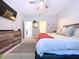 This bedroom features a ceiling fan, TV, natural lighting, and neutral walls at 8830 Fox Dr, Polk City, FL 33868