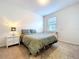 This bedroom has a queen bed, nightstands, and natural light at 8830 Fox Dr, Polk City, FL 33868