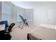 Bright bedroom featuring carpet, large windows, and a desk space ideal for work or study at 8830 Fox Dr, Polk City, FL 33868