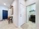 Entryway with a bench and an open doorway to the laundry room at 8830 Fox Dr, Polk City, FL 33868