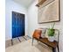 Inviting entryway with bench seating, decorative rug, and stylish wall art at 8830 Fox Dr, Polk City, FL 33868