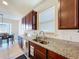 Kitchen area features granite counters, stainless appliances, a modern faucet and recessed lighting at 8830 Fox Dr, Polk City, FL 33868