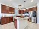 Modern kitchen with stainless steel appliances, granite countertops, and a center island at 8830 Fox Dr, Polk City, FL 33868