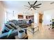 Spacious living room flowing into the kitchen with stainless steel appliances and ample counter space at 8830 Fox Dr, Polk City, FL 33868