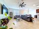 Bright living room featuring modern decor, large windows, and an open layout at 8830 Fox Dr, Polk City, FL 33868