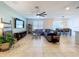 Spacious open-concept living room and dining area with abundant natural light and tiled flooring at 8830 Fox Dr, Polk City, FL 33868