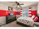 Nicely decorated bedroom featuring a TV, dresser, and striped curtains by the window at 1123 Sugarwood St, Davenport, FL 33837