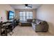 Bonus room area featuring plush carpet, a ceiling fan, and a large sectional sofa at 1123 Sugarwood St, Davenport, FL 33837
