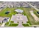 Aerial view of community pool and amenity center, featuring a large parking lot at 1123 Sugarwood St, Davenport, FL 33837