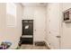View of entryway with a hall tree bench, a white door, and wood-look floors at 1123 Sugarwood St, Davenport, FL 33837