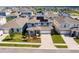 Beautiful two-story home featuring solar panels, well-manicured landscaping, and a two car garage at 1123 Sugarwood St, Davenport, FL 33837