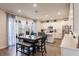 This bright kitchen features an eat-in space, an island, stainless appliances and opens to the back patio at 1123 Sugarwood St, Davenport, FL 33837