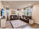 Comfortable living room with leather recliners, a patterned rug, and natural light from the windows at 1123 Sugarwood St, Davenport, FL 33837