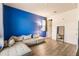 Living room features an accent wall, a sectional sofa, and recessed lighting at 1123 Sugarwood St, Davenport, FL 33837