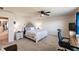 Bright main bedroom featuring a comfortable bed, ceiling fan, and neutral decor at 1123 Sugarwood St, Davenport, FL 33837