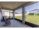 The comfortable screened patio offers a peaceful view of the backyard at 1123 Sugarwood St, Davenport, FL 33837