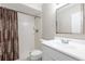 Bathroom featuring shower, tile floors, white vanity and sink at 5926 N Fork Ct, Lakeland, FL 33809