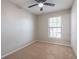 Cozy bedroom with neutral carpet, natural light, and ceiling fan at 5926 N Fork Ct, Lakeland, FL 33809