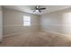 Neutral bedroom with carpet, base molding and natural light at 5926 N Fork Ct, Lakeland, FL 33809