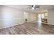 Open living room with wood flooring, connecting to the dining area and kitchen, creates an inviting atmosphere at 5926 N Fork Ct, Lakeland, FL 33809