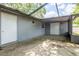 Covered porch featuring exterior access doors and a concrete patio area at 5926 N Fork Ct, Lakeland, FL 33809