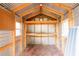 Shed interior featuring wood framing, shelving, and windows for added storage and natural light at 5926 N Fork Ct, Lakeland, FL 33809