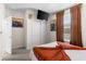 Bright bedroom with Star Wars decorations, large window, and a double door closet at 7614 Oak Spring Ln, Davenport, FL 33837