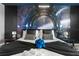 Bedroom featuring space-themed wall art and well-appointed decor at 7614 Oak Spring Ln, Davenport, FL 33837