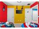 Bedroom with superhero themed bedding, art, and dual closets at 7614 Oak Spring Ln, Davenport, FL 33837