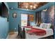 Bedroom featuring an ornate headboard, drop ceiling, and Harry Potter themed decorations at 7614 Oak Spring Ln, Davenport, FL 33837