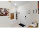 Inviting entryway with a custom built-in bench, wall art, and modern accents at 7614 Oak Spring Ln, Davenport, FL 33837