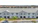 Townhome community offers well-maintained exteriors and convenient parking for residents and guests at 7614 Oak Spring Ln, Davenport, FL 33837