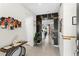 Hallway with stylish decor and design elements, leading into the open living spaces at 7614 Oak Spring Ln, Davenport, FL 33837