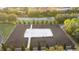 An aerial view showcases a sand volleyball court surrounded by a mulch border at 7614 Oak Spring Ln, Davenport, FL 33837