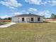 Charming single-story home featuring a neatly manicured lawn and attached one car garage at 2680 Sw 144 Ct, Ocala, FL 34481