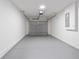Clean, spacious garage with an overhead door and painted walls at 2680 Sw 144 Ct, Ocala, FL 34481