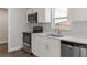 Bright kitchen featuring stainless steel appliances, white cabinets, and quartz countertops at 2680 Sw 144 Ct, Ocala, FL 34481