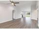 Spacious living room with modern ceiling fan and modern flooring at 2680 Sw 144 Ct, Ocala, FL 34481