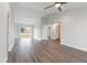 Open-concept living room with modern flooring, ceiling fan, and view of the backyard at 2680 Sw 144 Ct, Ocala, FL 34481